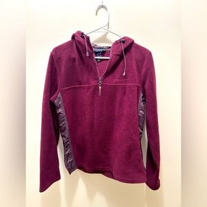 Half zip, with hood.